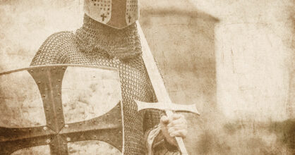Kuvassa on ritari miekka ja kilpi kädessään.
